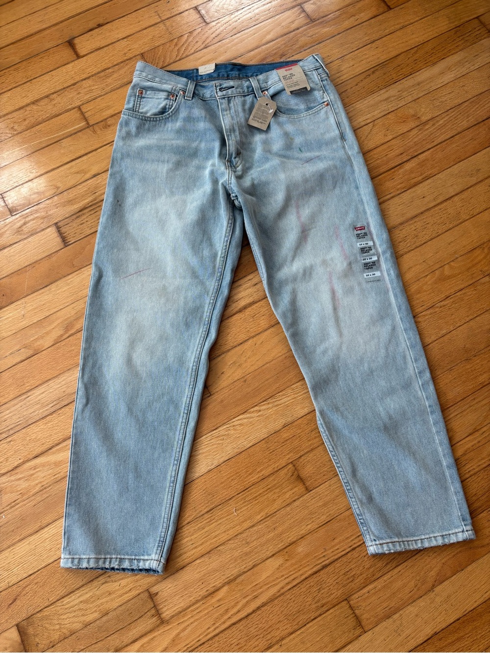 Levi's 550 '92 Relaxed Taper, Light Stonewash Jeans with pen mark paint details
